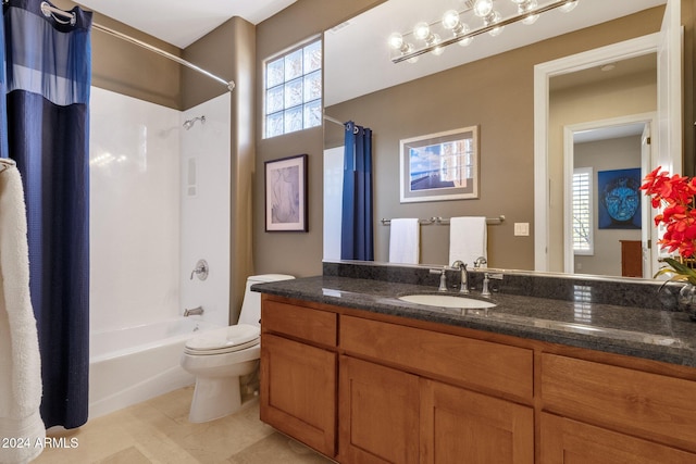 full bathroom with vanity, shower / bath combo with shower curtain, and toilet