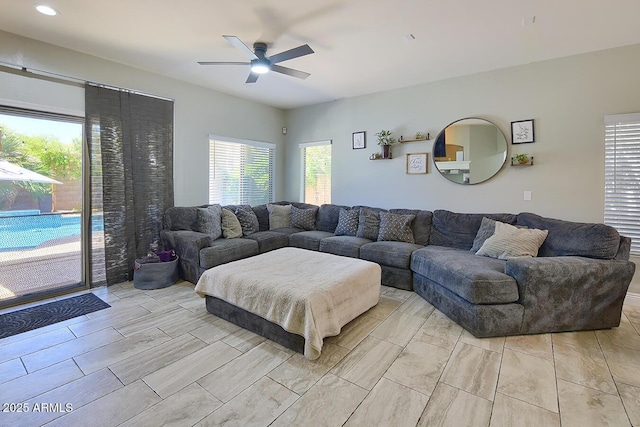 living area featuring a ceiling fan
