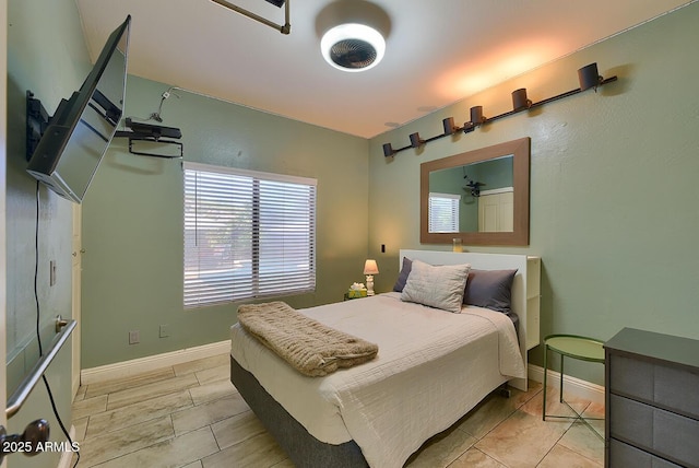 bedroom featuring baseboards