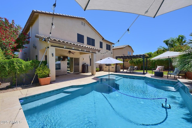 view of pool featuring ceiling fan, fence, a pergola, a fenced in pool, and a patio area