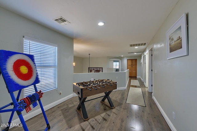 game room featuring baseboards, recessed lighting, wood finished floors, and visible vents