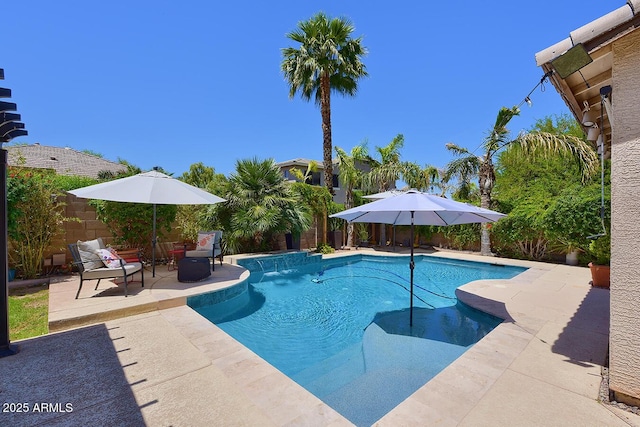 view of swimming pool featuring a fenced in pool, a fenced backyard, and a patio area