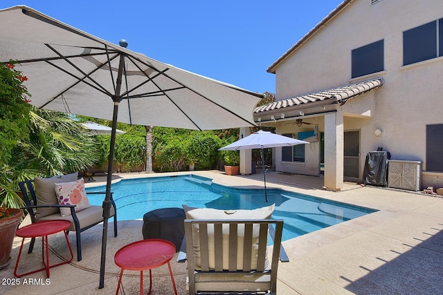 pool featuring a patio and ceiling fan