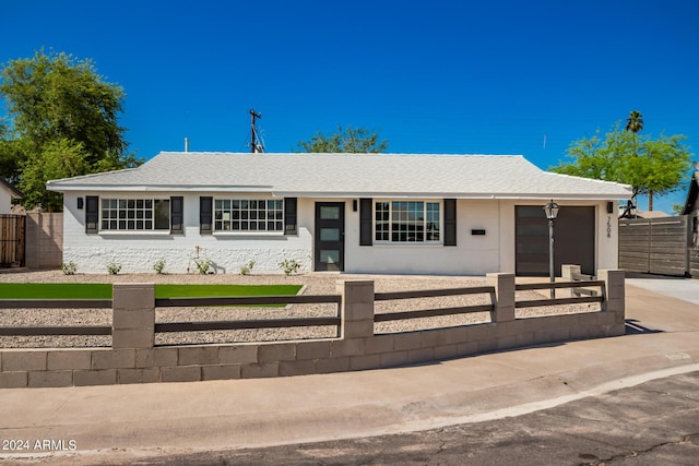 7508 E Beatrice St, Scottsdale, AZ 85257 - ranch-style home featuring concrete driveway, a fenced front yard, a shingled roof, and a garage