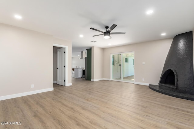 7508 E Beatrice St, Scottsdale, AZ 85257 - unfurnished living room with baseboards, a ceiling fan, and light wood-style floors