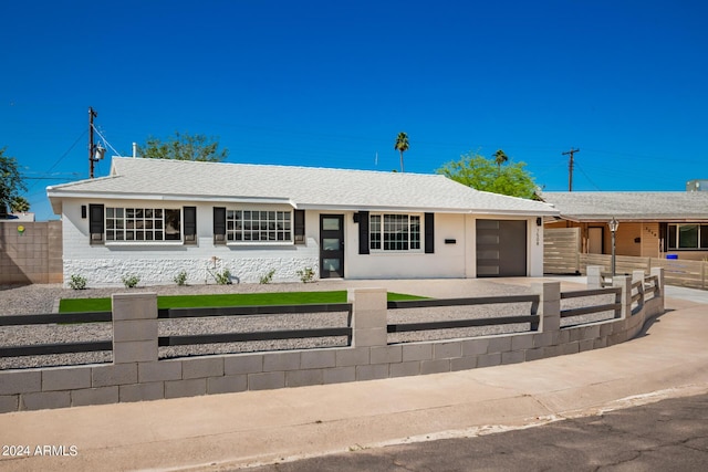 7508 E Beatrice St, Scottsdale, AZ 85257 - ranch-style home with an attached garage, a fenced front yard, and driveway