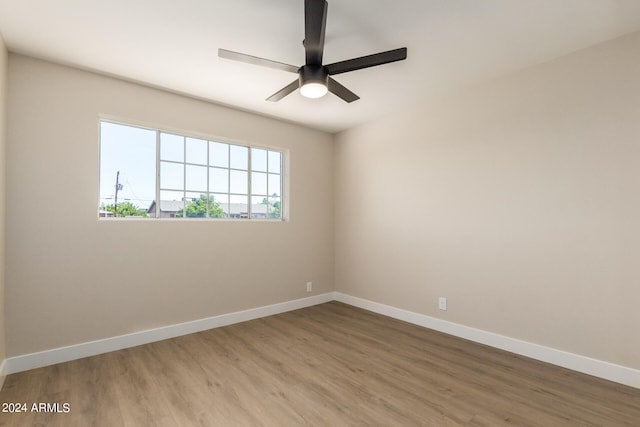 unfurnished room featuring hardwood / wood-style floors and ceiling fan