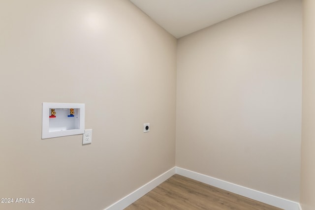 clothes washing area featuring electric dryer hookup, washer hookup, and hardwood / wood-style floors