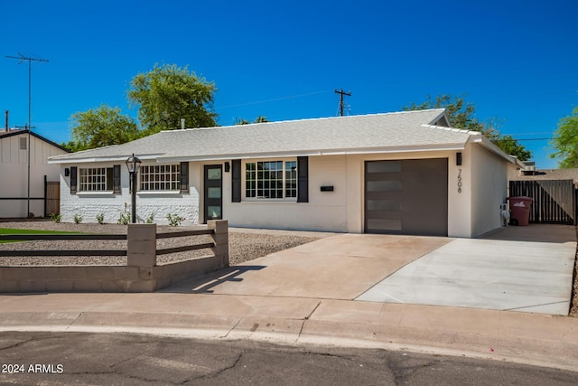 7508 E Beatrice St, Scottsdale, AZ 85257 - single story home with roof with shingles, concrete driveway, a garage, fence private yard, and stucco siding