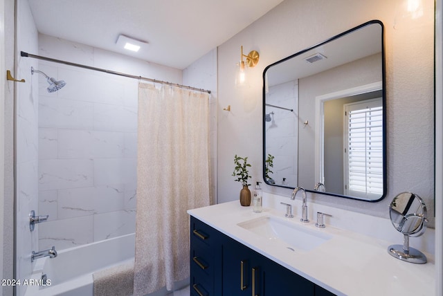 bathroom featuring vanity and shower / bath combo with shower curtain