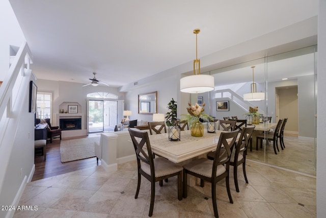 tiled dining room featuring ceiling fan