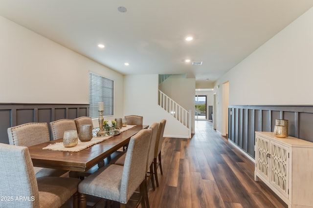 dining room with dark hardwood / wood-style flooring