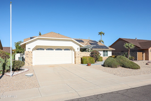 ranch-style house featuring a garage