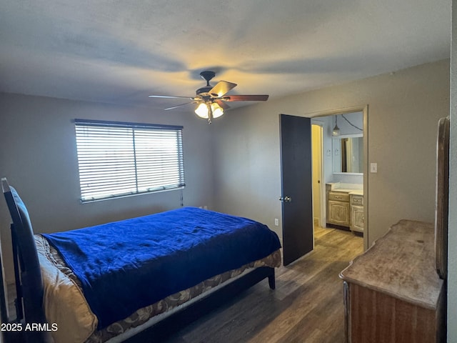 bedroom with dark wood-style floors and a ceiling fan