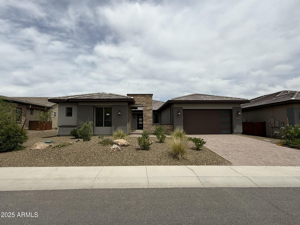 4145 Fence Post Way, Wickenburg, AZ 85390 - prairie-style house with driveway, stucco siding, and an attached garage