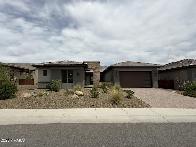 4145 Fence Post Way, Wickenburg, AZ 85390 - prairie-style house with driveway, stucco siding, and an attached garage