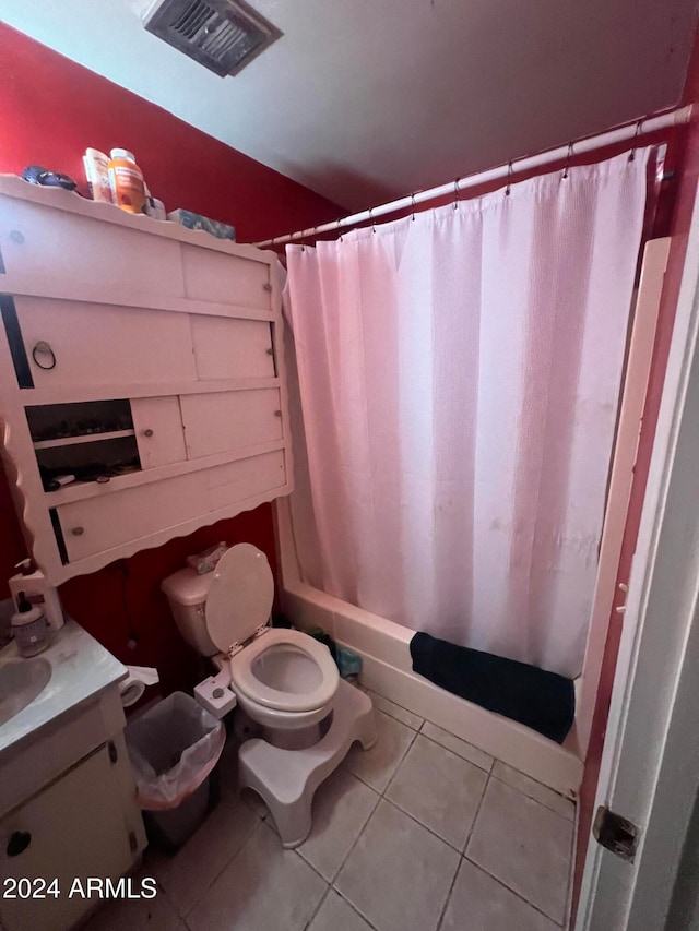 full bathroom featuring vanity, shower / bath combo, tile patterned floors, and toilet