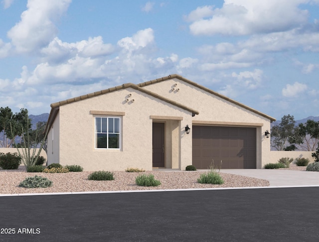 4517 S 95th Dr, Tolleson, AZ 85353 - mediterranean / spanish home with concrete driveway, a garage, a mountain view, and stucco siding