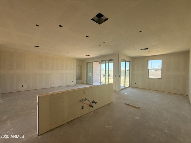 4517 S 95th Dr, Tolleson, AZ 85353 - unfurnished room featuring concrete floors and a textured ceiling