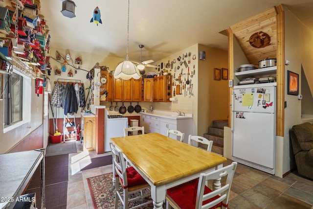 583 Reata Pass, Happy Jack, AZ 86024 - dining area featuring stairway, washer / dryer, and a ceiling fan