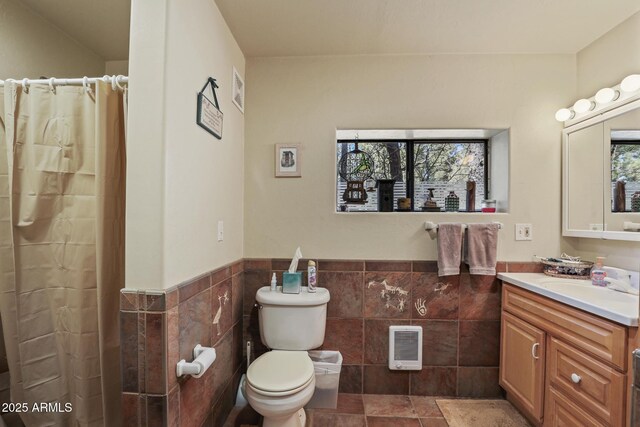 583 Reata Pass, Happy Jack, AZ 86024 - bathroom with plenty of natural light, toilet, vanity, and tile walls