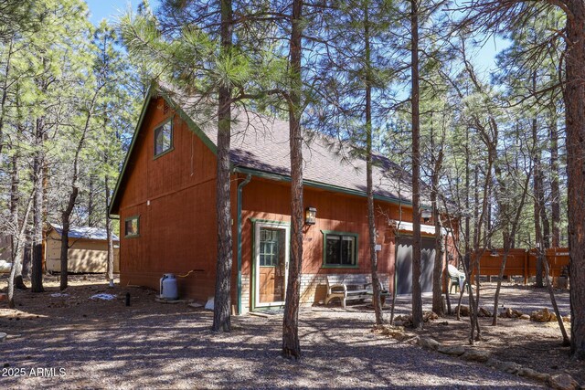 583 Reata Pass, Happy Jack, AZ 86024 - rear view of house with roof with shingles