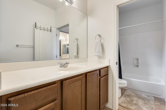 full bathroom featuring vanity, toilet, tile patterned floors, and shower / bath combo