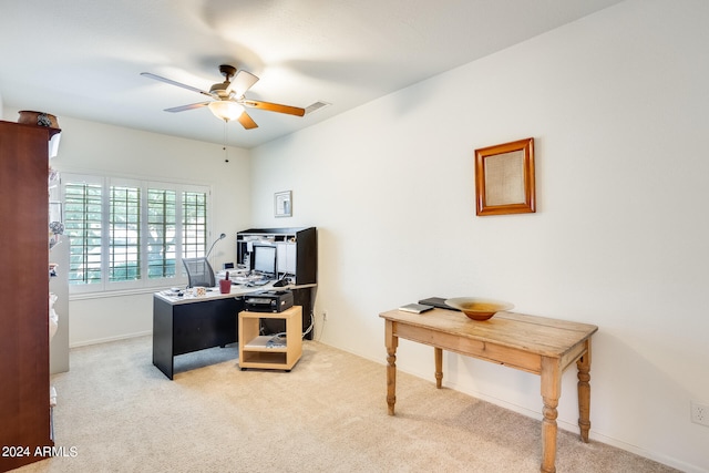 home office with carpet flooring and ceiling fan