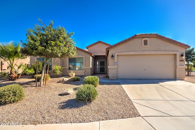 43581 W Mccord Dr, Maricopa, AZ 85138 - view of front of house with stucco siding, a garage, concrete driveway, and a tile roof