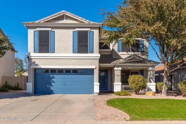 front of property with a garage