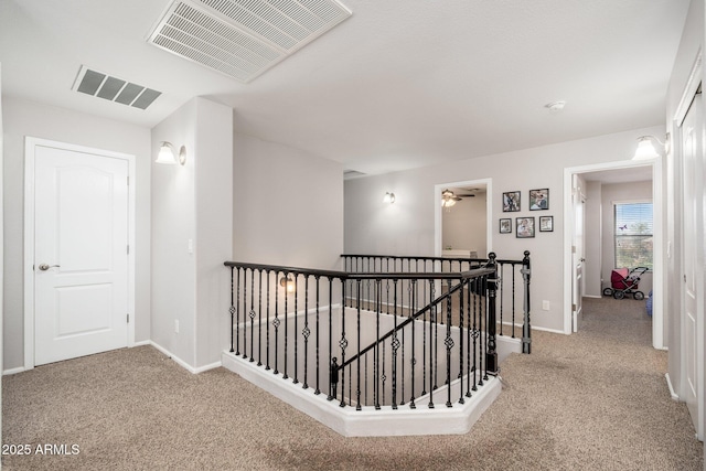 corridor with carpet floors