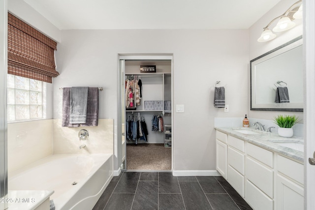 bathroom with a bathing tub and vanity