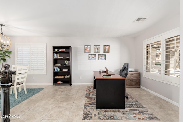 tiled office space featuring a chandelier