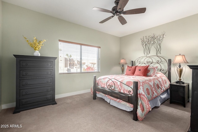 bedroom featuring ceiling fan, baseboards, and light colored carpet