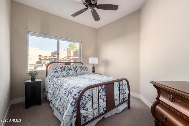 carpeted bedroom featuring ceiling fan and baseboards