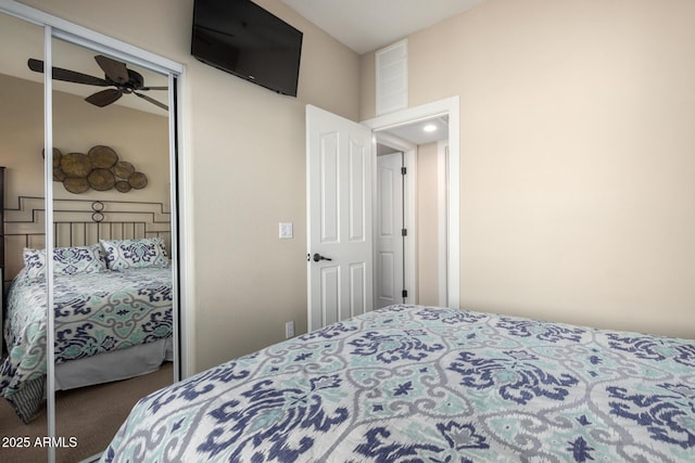 carpeted bedroom featuring a closet