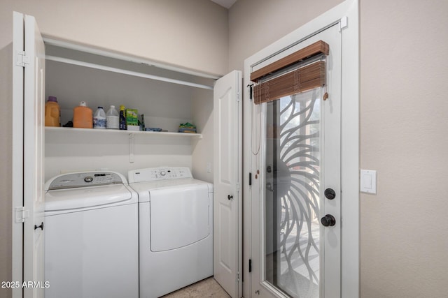 laundry area with laundry area and washer and clothes dryer