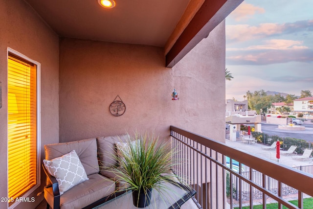 view of balcony at dusk