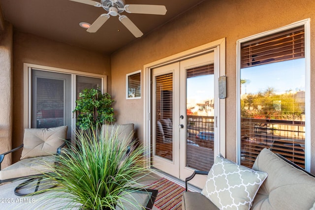 balcony with ceiling fan and french doors