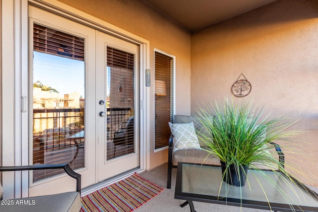 doorway to property with french doors and stucco siding