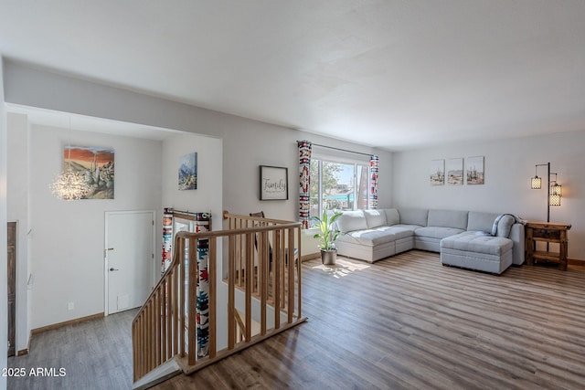 living area featuring wood finished floors and baseboards