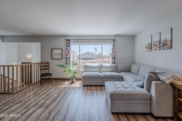 living room with wood finished floors and baseboards