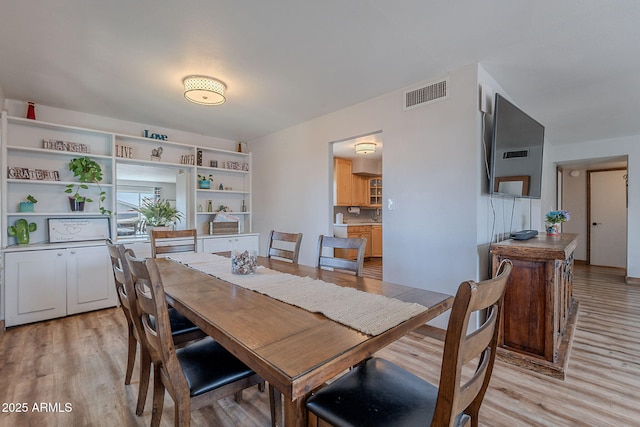 dining room featuring light wood-style floors