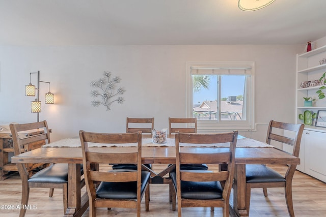 dining room with light wood-type flooring