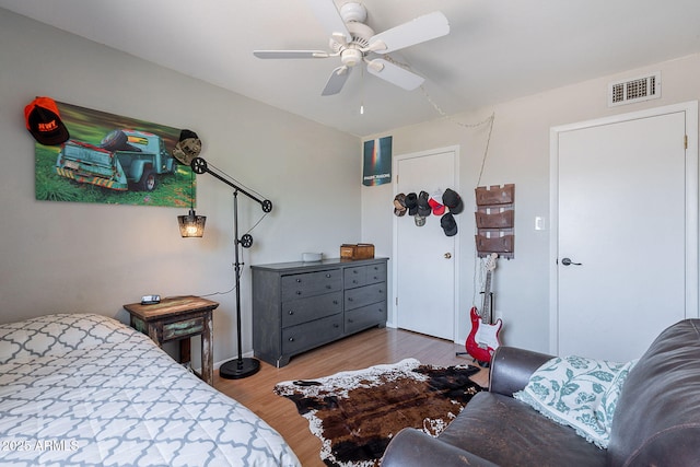 bedroom featuring wood finished floors and a ceiling fan