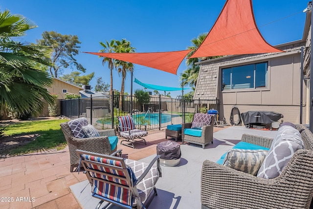 view of patio with fence, an outdoor hangout area, and area for grilling