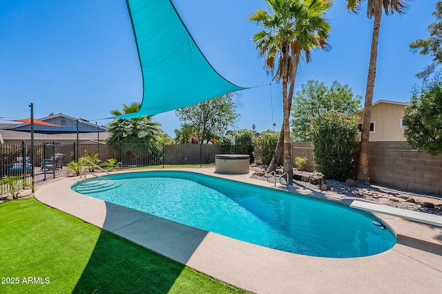 view of swimming pool with a fenced backyard and a patio