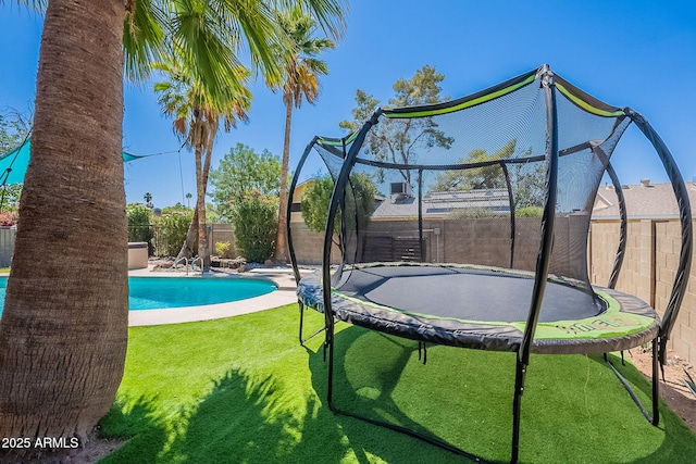 view of pool with a trampoline