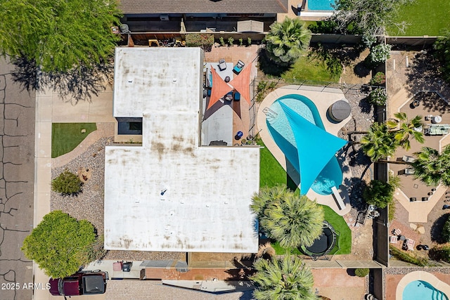drone / aerial view of a pool