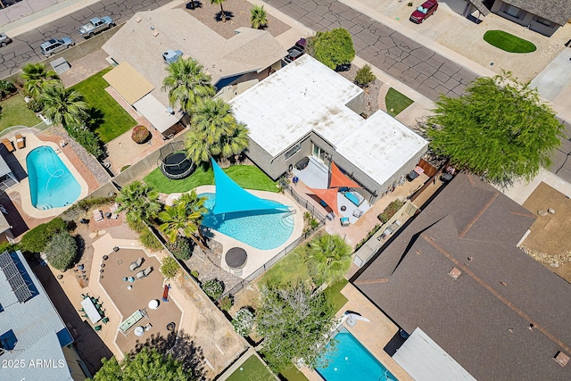 aerial view of residential area featuring a pool
